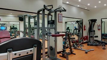 an overview of the Gym with many equipment inside at Caravela Beach resort