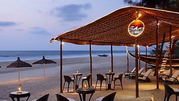 alfresco seating next to the beach at Sunset-Bar at Caravela Beach Resort - Restaurants in South Goa