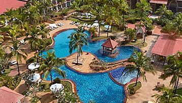 Aerial view of Caravela Beach resort with tree covers surrounding it