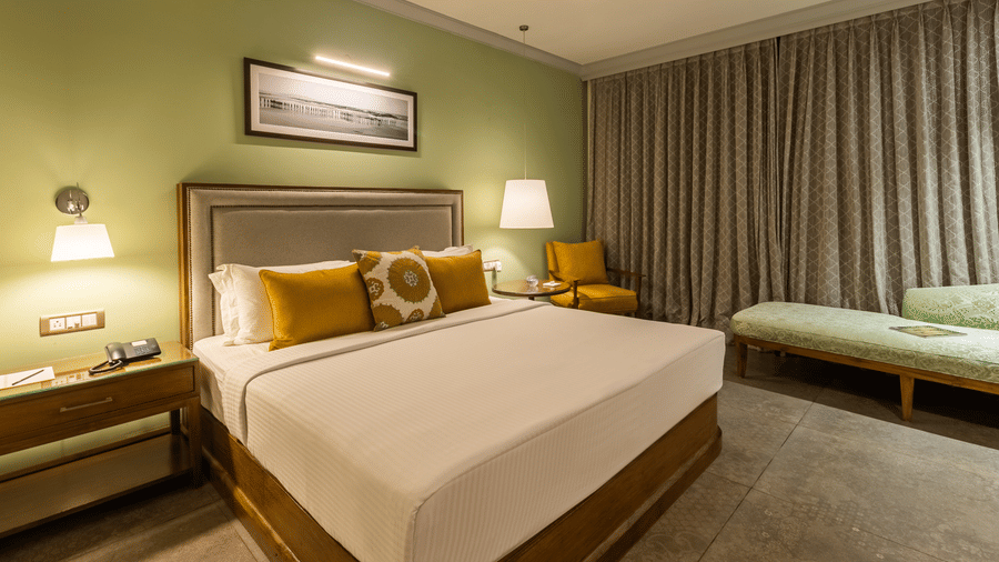 club rooms in south goa designed with a cosy bed and elegant interiors - kids friendly resort in south goa