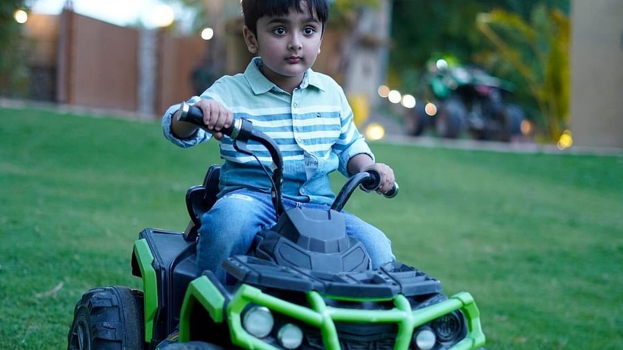 A child riding electric car at Themis Mudhouse - A Nature's Retreat Resort & Wellness
