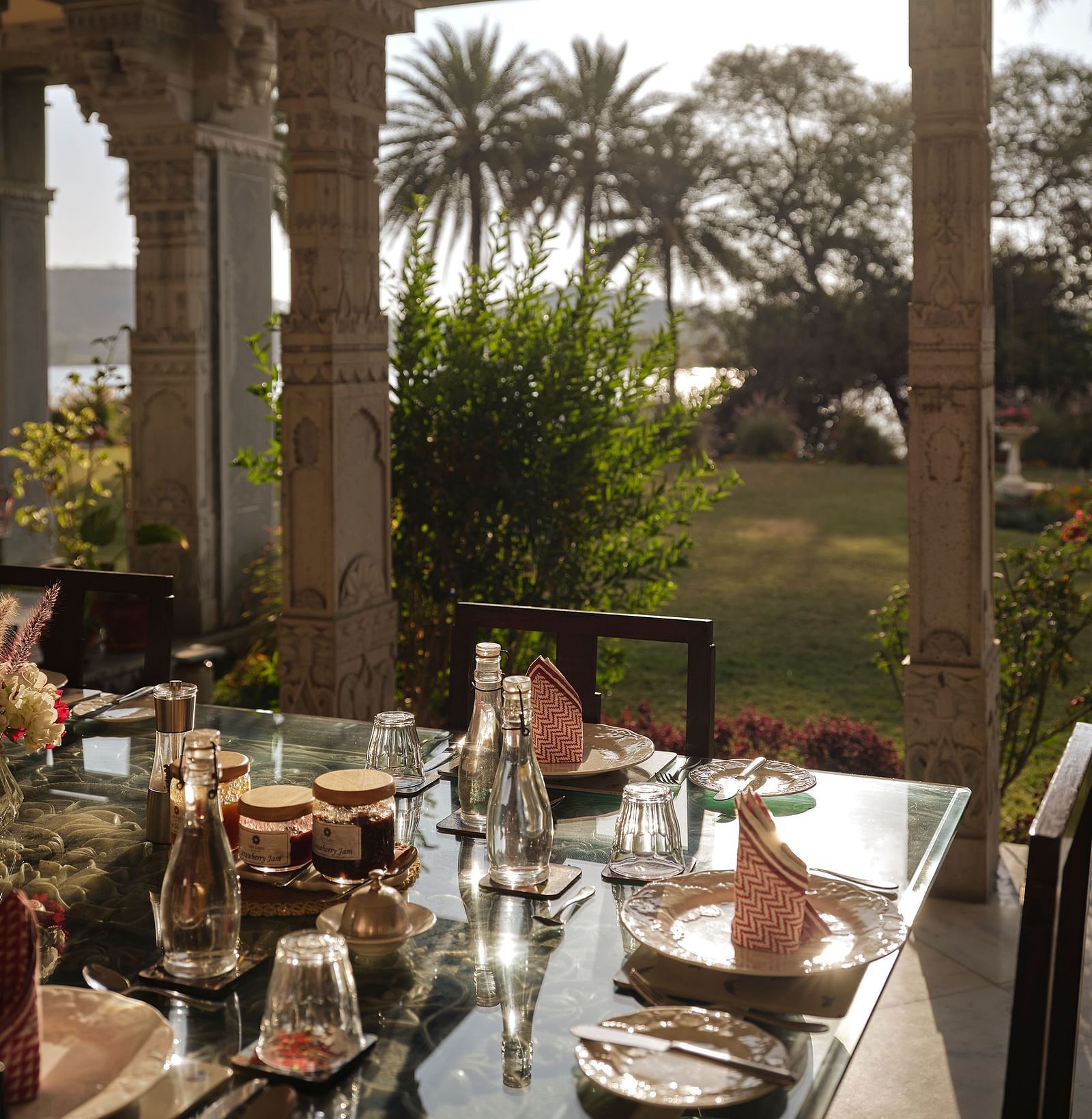 image of the dining area overlooking at the lush green lawn at dev shree, deogarh