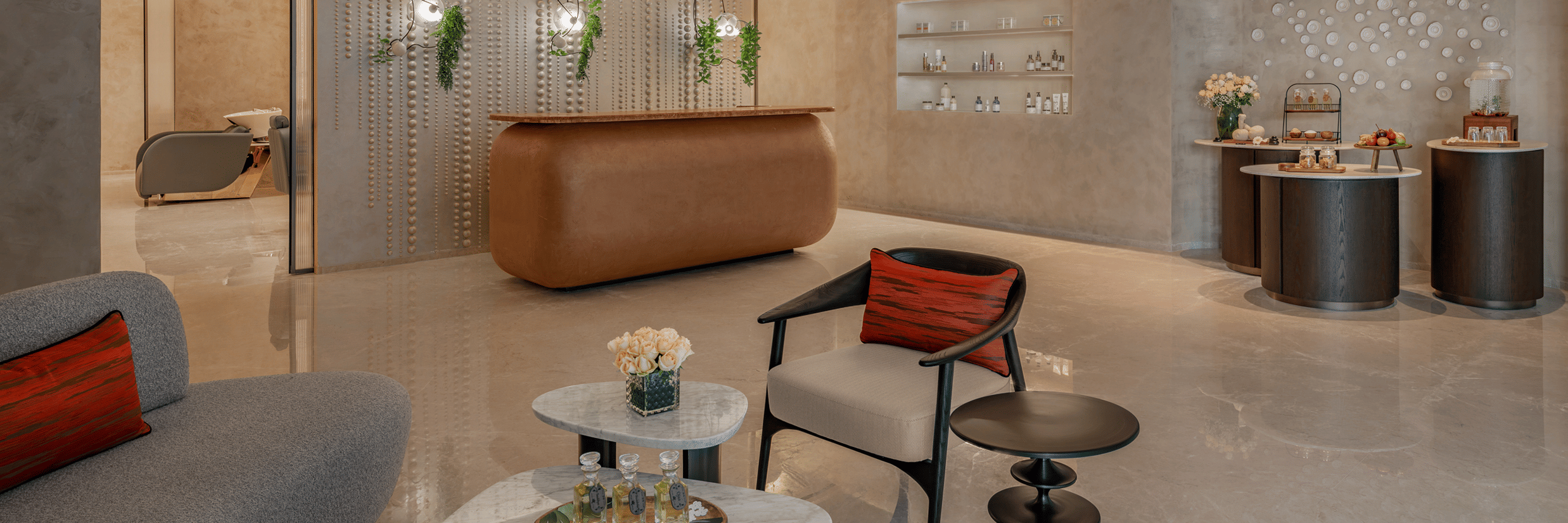 Spa reception and lounge area with seating, a reception desk and ambient lighting at The Residency Signature Madurai.
