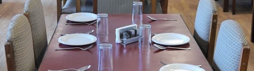 An image of the restaurant with its seating arrangement at Ecotel Chiminda, Pelling
