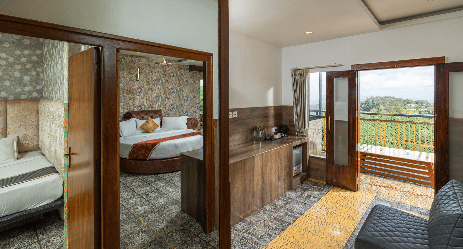 A side view of a living area at Family Jacuzzi Room at Parakkat Nature Hotel and Resorts, Munnar, featuring wooden furnishing, a single seating sofa, and an opening towards a private balcony.