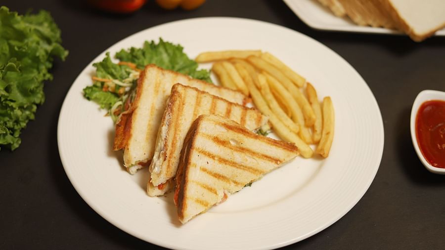 An image of sandwiches served with french fries at a restaurant in Five Elements Hotels North Avenue, Delhi