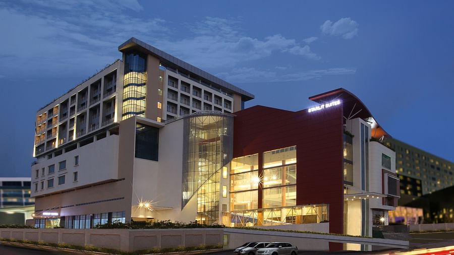 Facade image of Starlit Suites, Kochi in the evening with the lights on