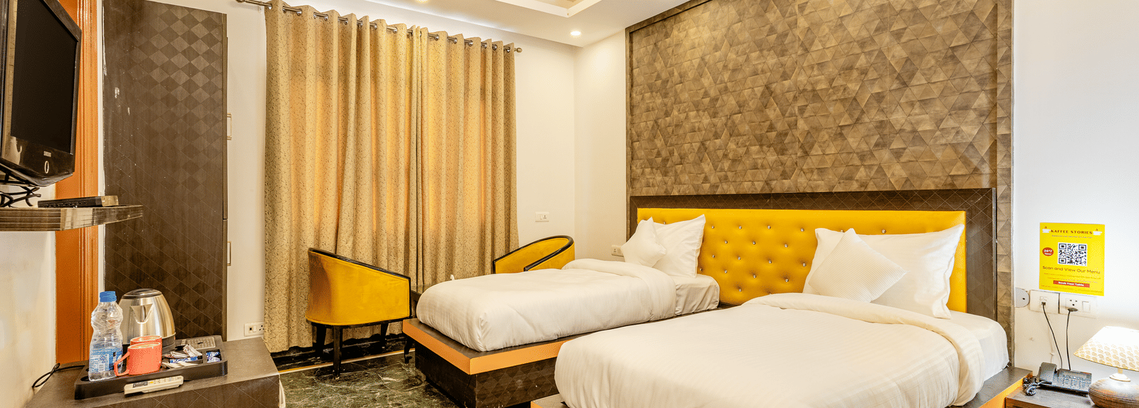 wide view of twin beds facing television in the superior double or twin room at Lime Tree Hotels and Banquet Hall Near Huda Metro, Gurgaon