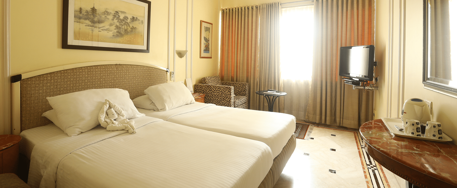 Twin beds in the Standard Room at Regency Hotel, Mumbai.