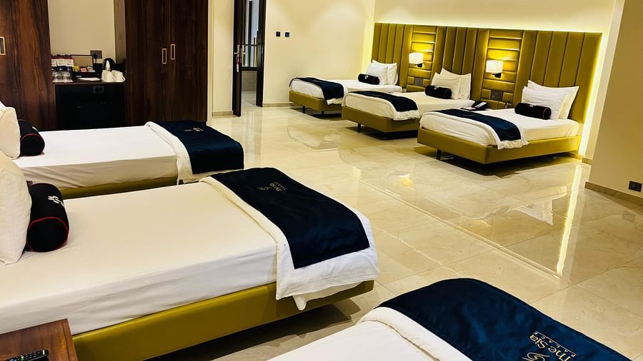 Bright family room with six single beds at Mastiff Grand The Sia Palace Suites & Banquets, Khopoli (Nr. Imagica).