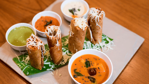 a close up image of a starter with dips kept next to it - VITS Sharanam, Thane