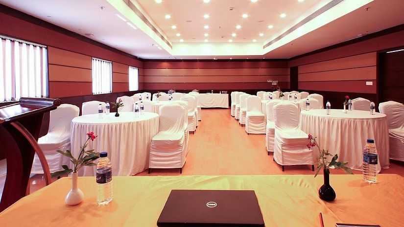 Rosetum Hotels - Interiors of conference hall in North Goa with round table seating.