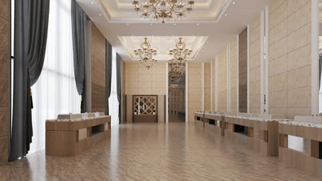 Full view of the expansive banquet hall with a high ceiling featuring elegant chandeliers hanging from the ceiling at Essentia Luxury Hotel and Convention, Nagpur.