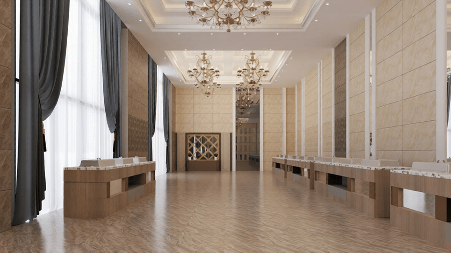 Full view of the expansive banquet hall with a high ceiling featuring elegant chandeliers hanging from the ceiling at Essentia Luxury Hotel and Convention, Nagpur.