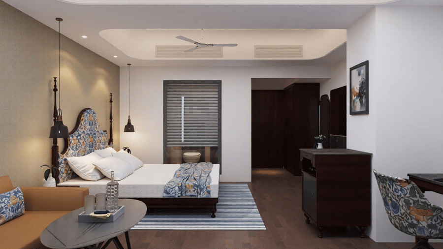 A room featuring a double bed at Essentia Luxury Hotel and Convention, Nagpur, with a wooden flooring along with a TV cabinet in front of it.