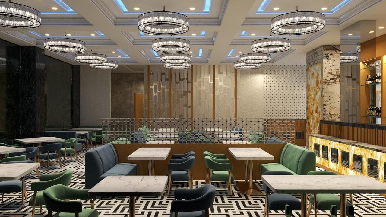 A stylish restaurant featuring chairs and tables, with round fancy lights at Hotel Mumbai House, Vashi