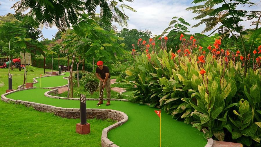 A person playing gold at the golf course - Ananta udaipur
