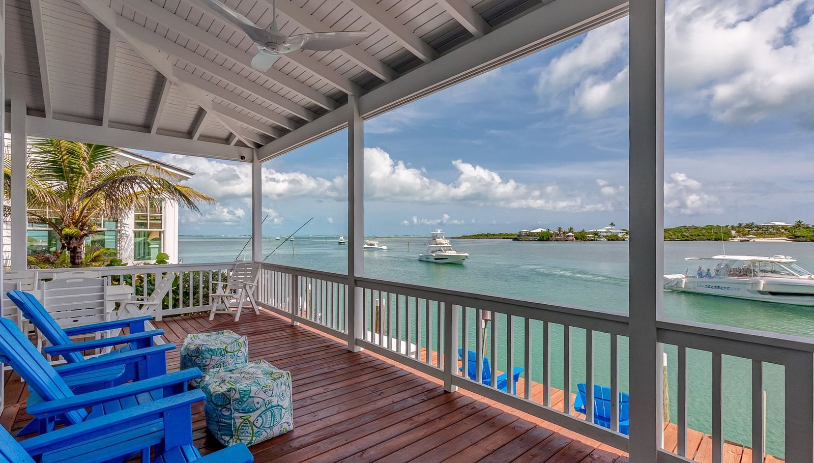 Deck with lounge chairs overlooking the water | Abaco Inn