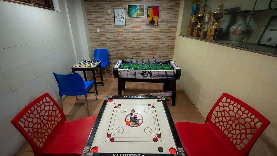 Indoor play area with a carrom board at Himalaya Hotel, Nainital