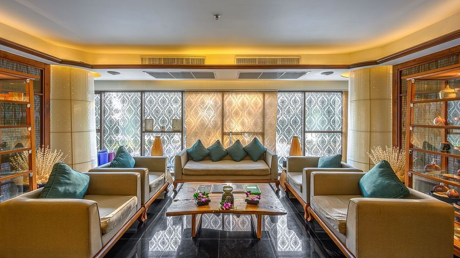 A waiting lobby featuring multiple sets of large sofas in an ambient setting with lots of natural lighting - Maikhao Dream Villa Resort & Spa, Phuket