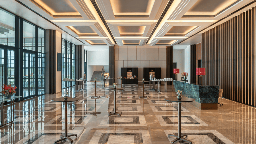 Convention Centre lobby area with marble flooring and floral decor at The Residency Signature Madurai.