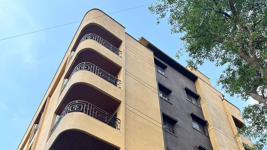 A low angle shot of the hotel building showcasing the balconies in each room at VITS Select Kharadi, Pune.