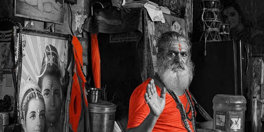 sadhu waving at the camera