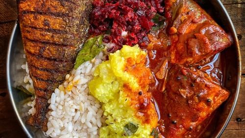 An image featuring a wholesome fish curry thali.