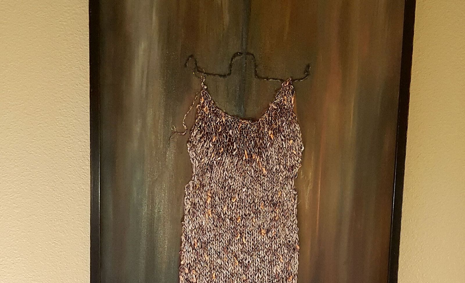A stylish framed dress art piece adding character to our room - Brewery Gulch Inn & Spa