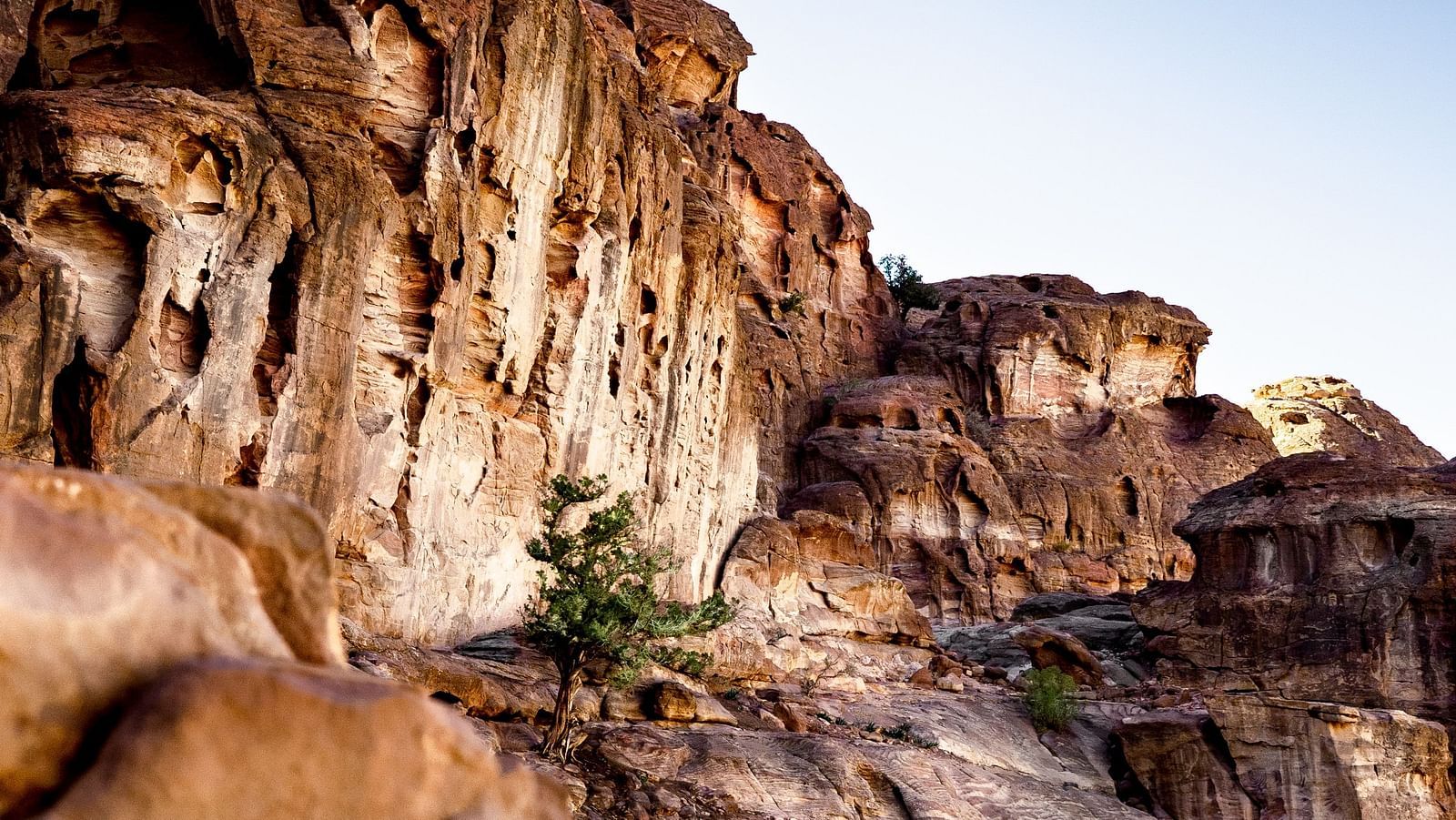 an image of the rocky mountains of the Canyon with blue sky in the background