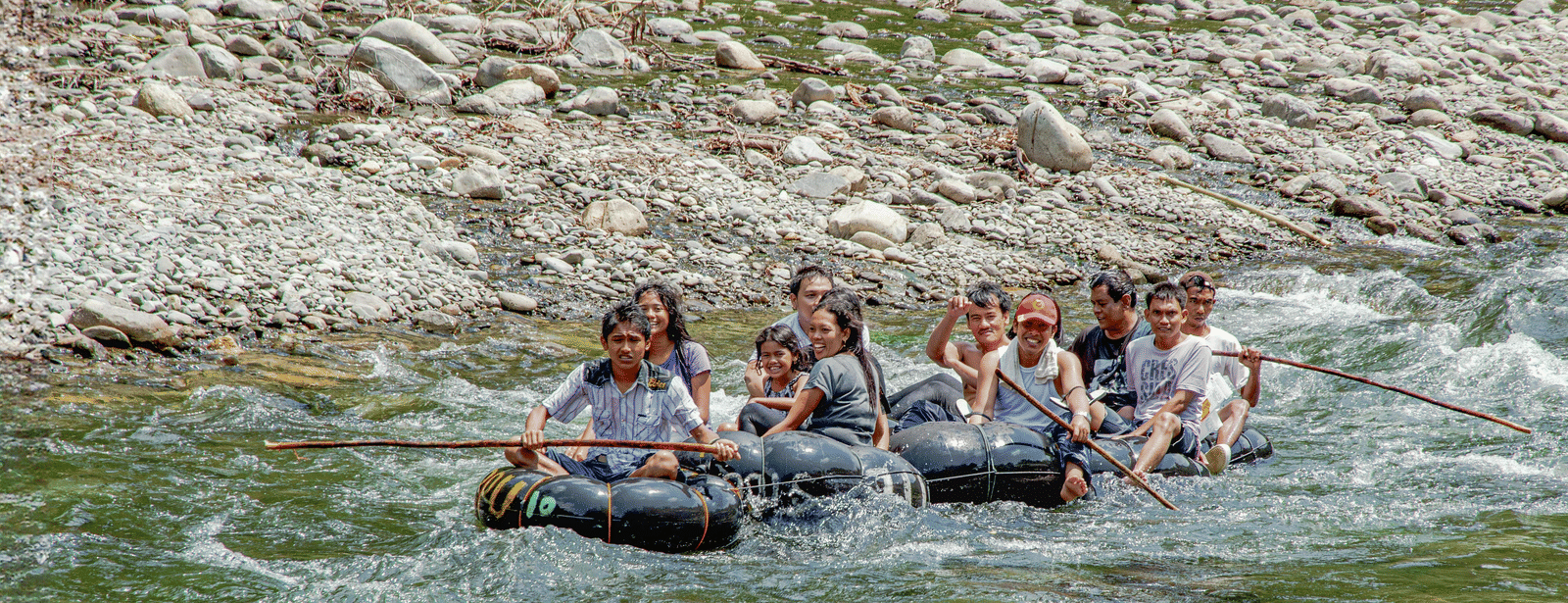 Group rafting through river rapids near Vedikant Resorts The Mallard Corbett.