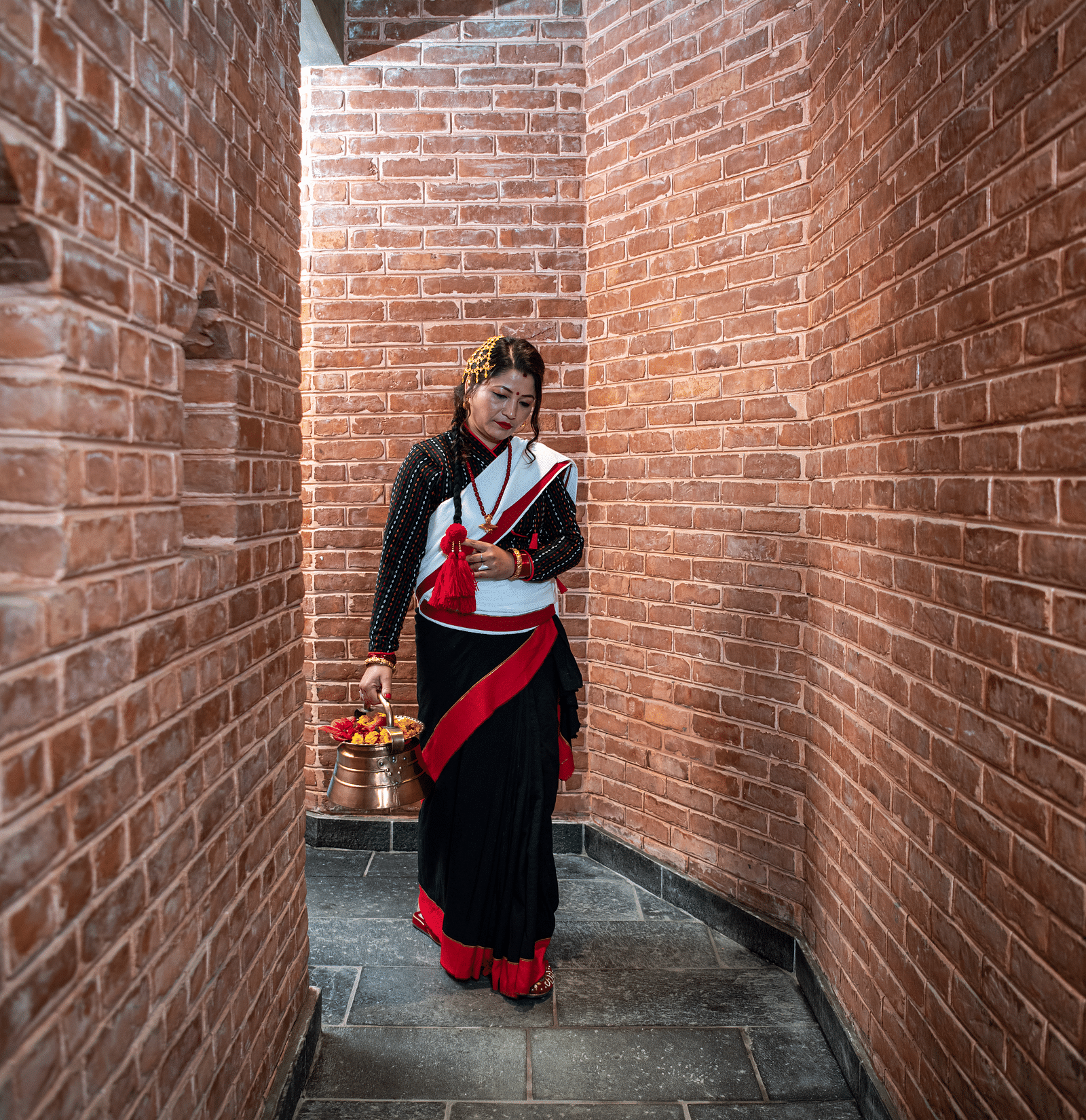 Street entrance to The Nanee where a women in traditional attire is seen walking