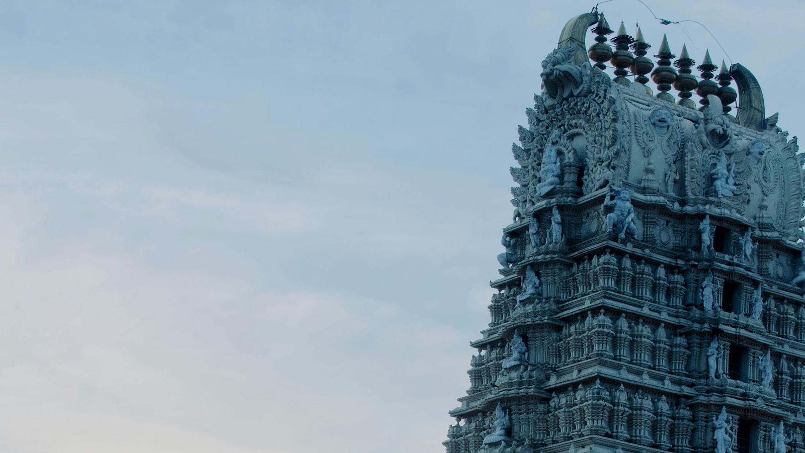 Gopuram of a temple that's one of the best places in Kakinada, with the expansive sky in the bachground.