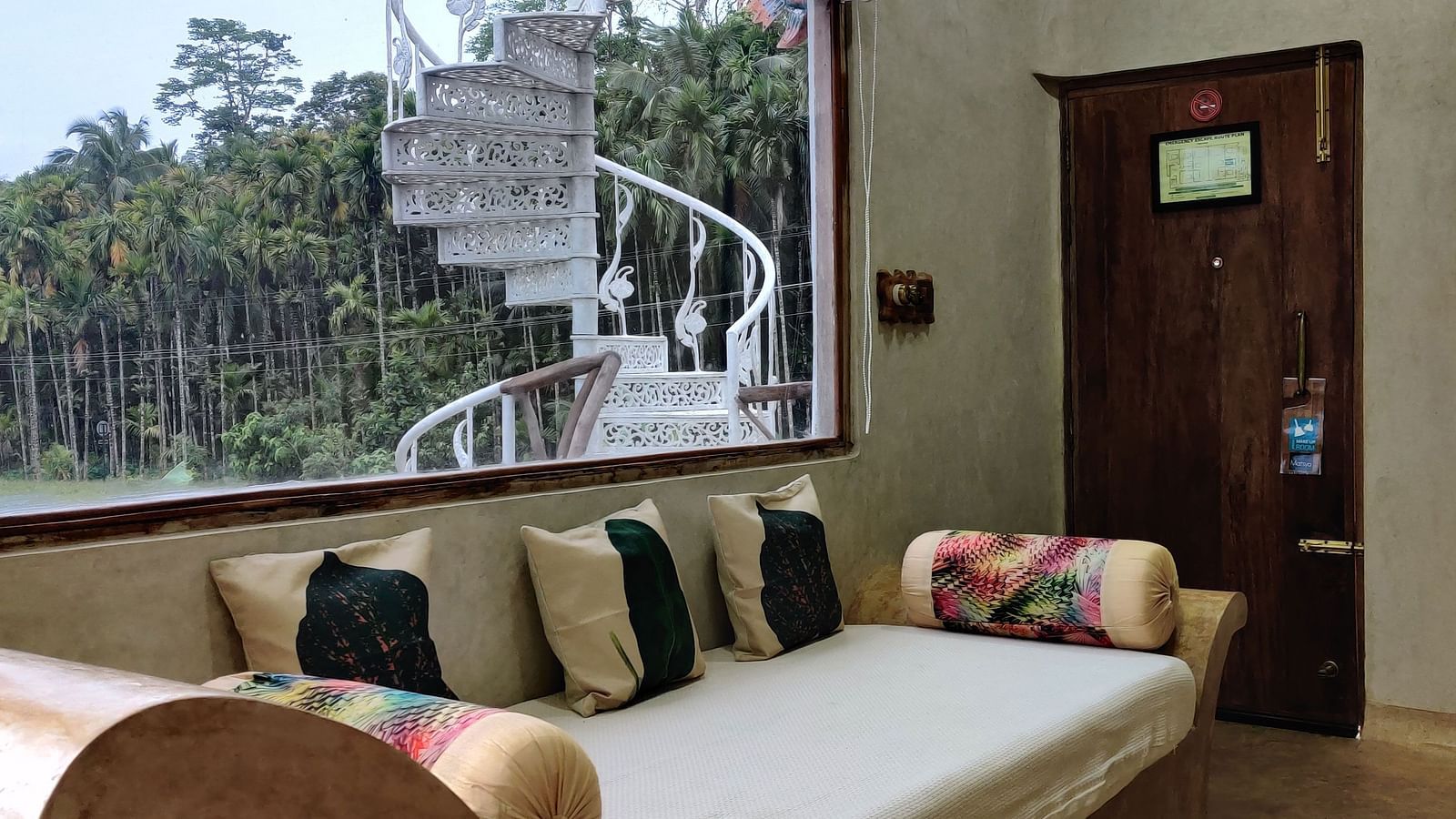 Elegant Amberjack Room with a comfy diwan and a big window, offering panoramic views.