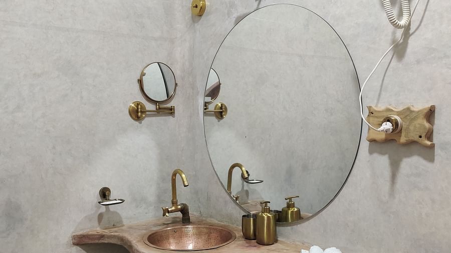 Marlin-washroom basin side view. Premium amenities like shaving mirror, hair dryer and dedicated face and hand towels can be seen.