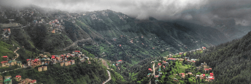 The image showcases a breathtaking mountain view, with towering peaks, lush greenery, and a serene landscape, offering a peaceful and majestic atmosphere.