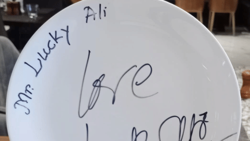 a plate with writing on it