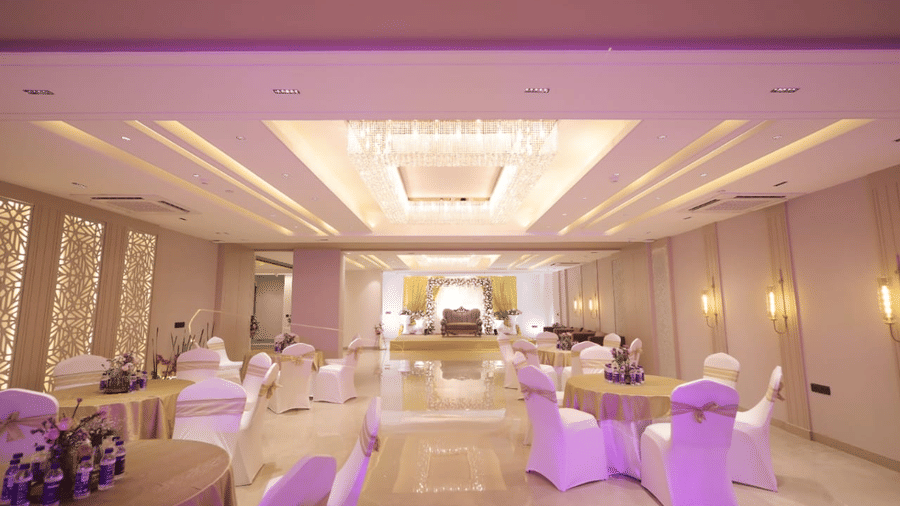 Full view of the Crystal Hall at Hotel 91 Privé, Gurugram, brightly lit with warm lighting.