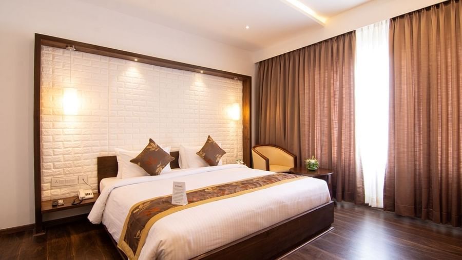 the bed offered in the Deluxe Room at The Liverpool Hotel