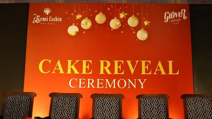An image of a stage set up with chairs for cake reveal ceremony - The Renai Cochin 