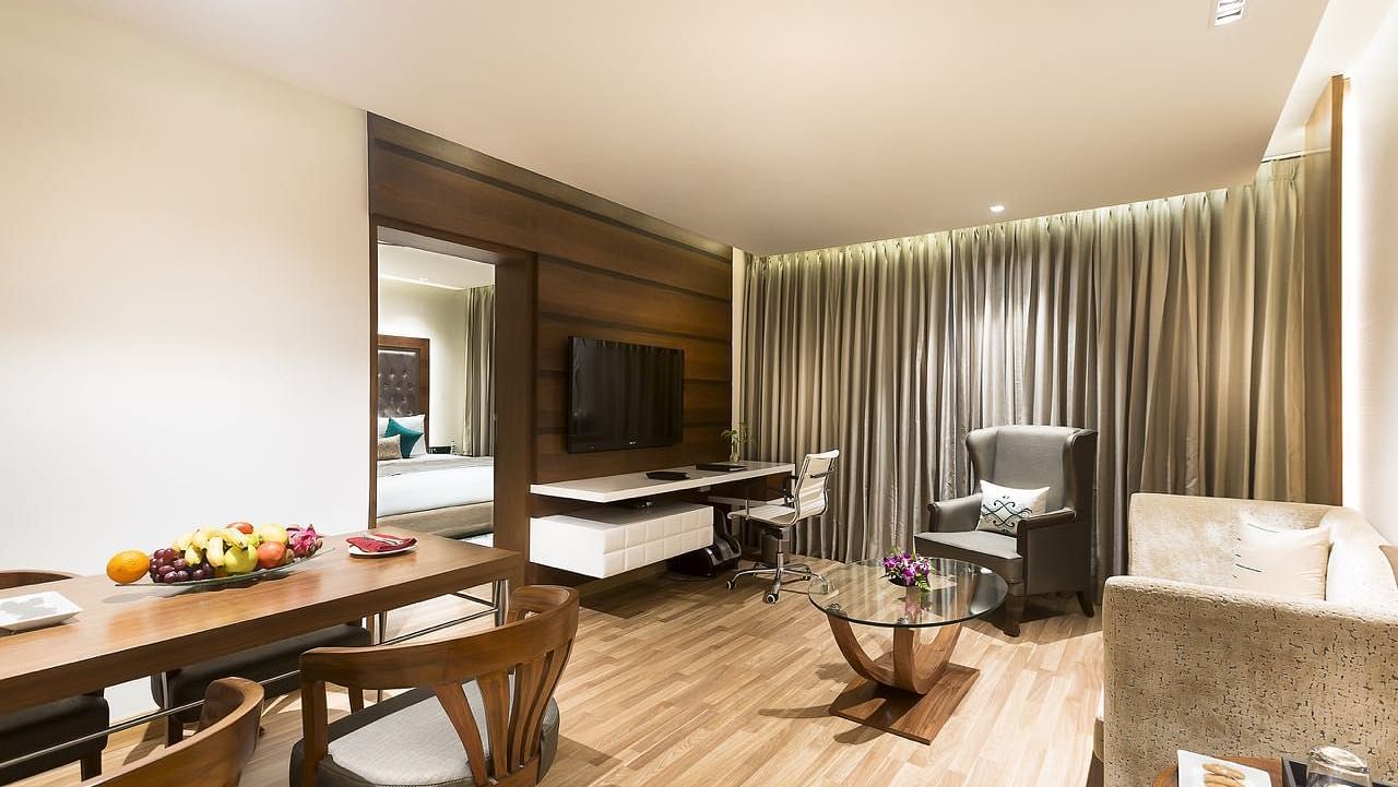 Living Room of Deluxe Suite at Grand Chennai By GRT Hotels.