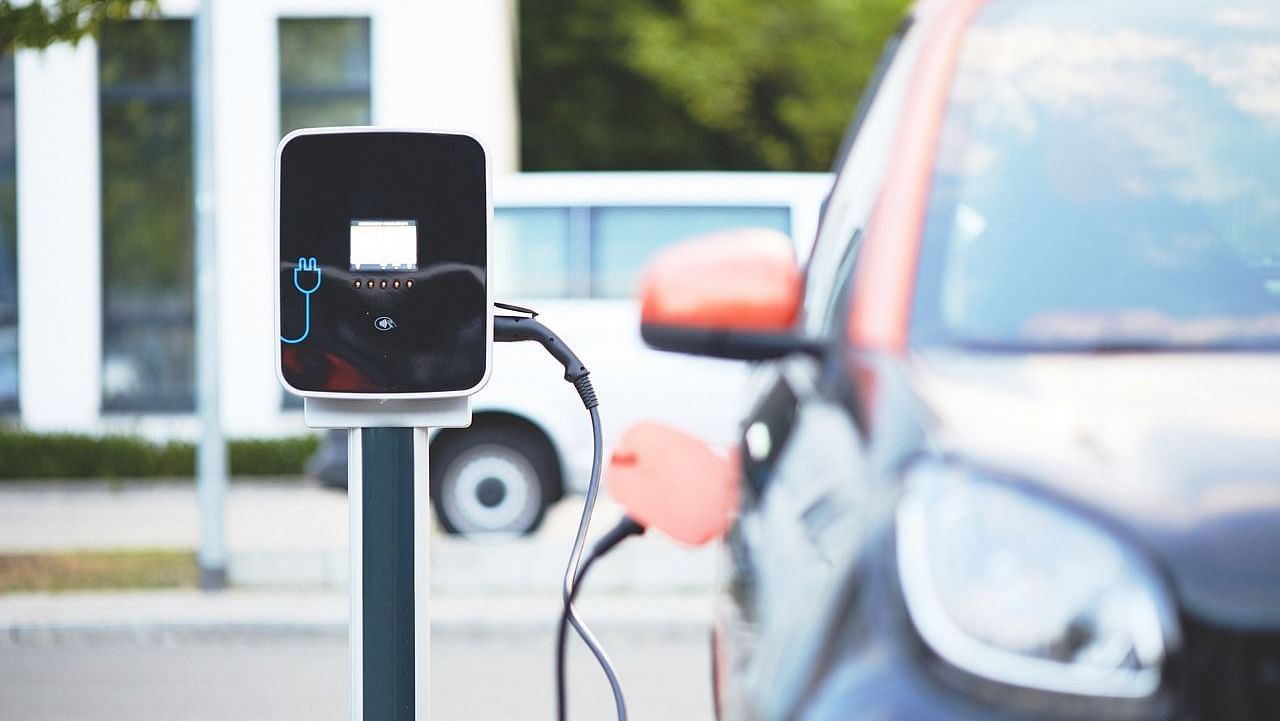 Electric car plugged into a public charging station