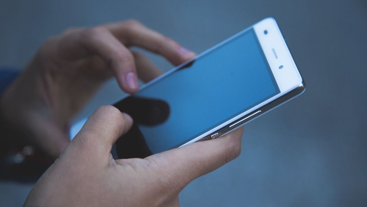 A hand holding a phone