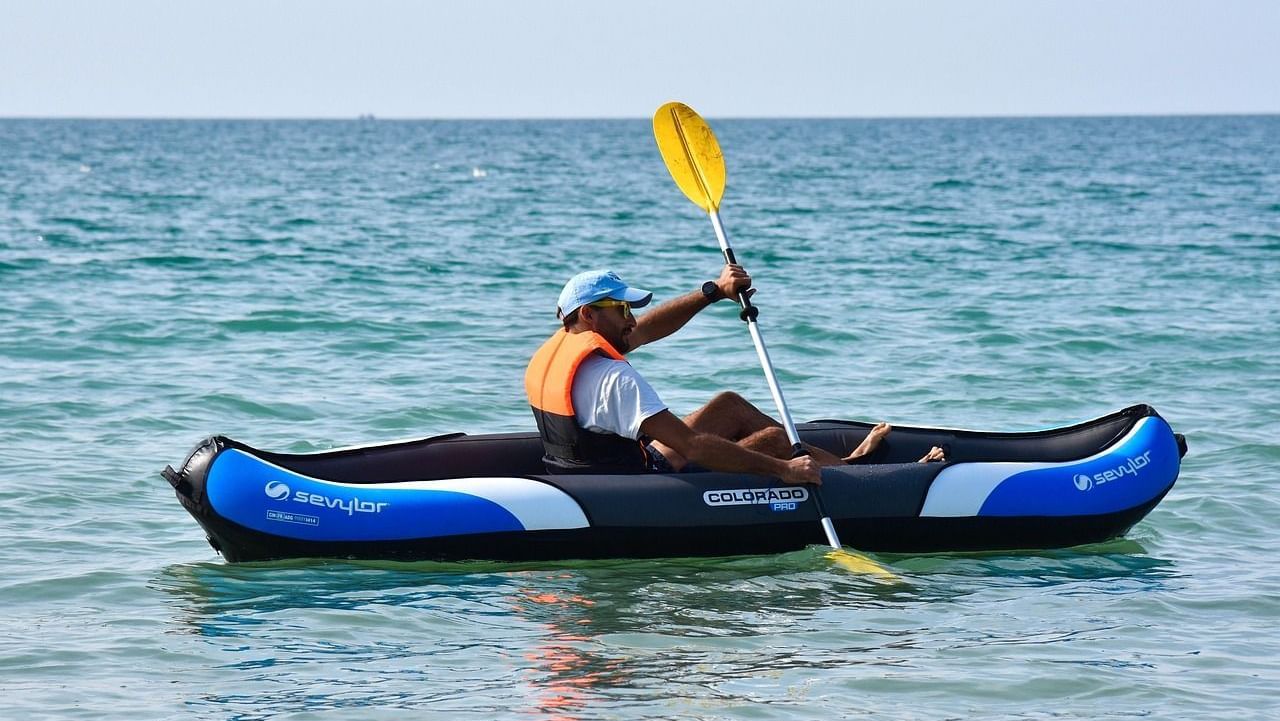 Close up shot of a person kayaking in the ocean solo.