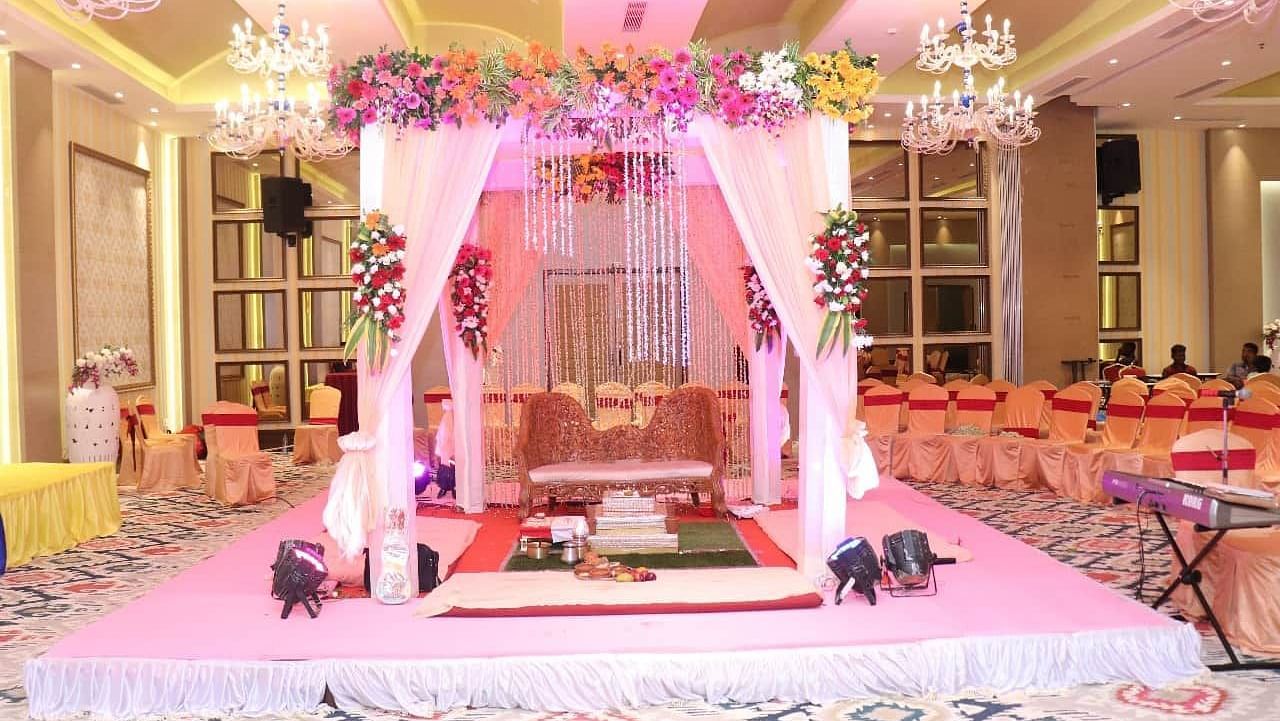 Wedding mandap arrangement in a banquet hall at Swosti Resorts