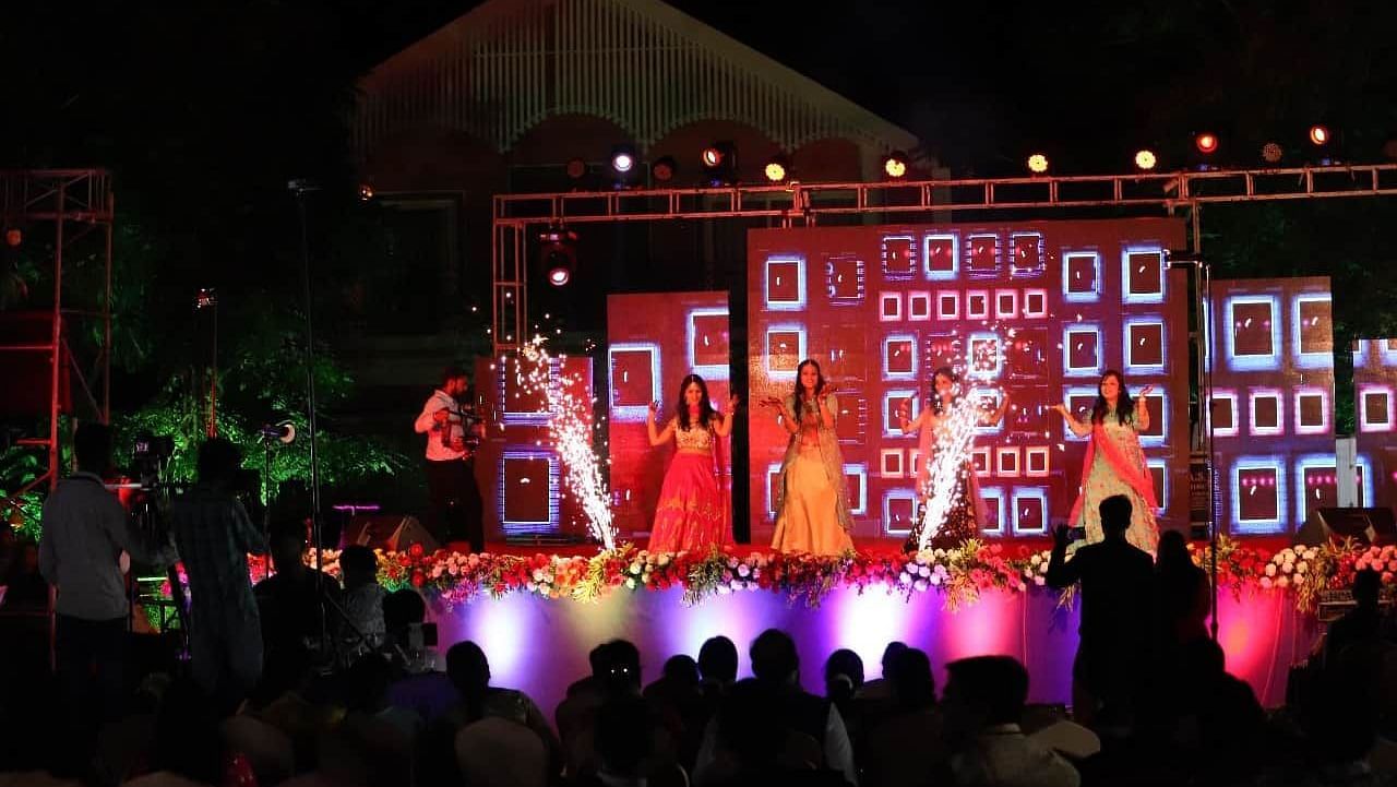 A dance performance on stage in the lawn at Swosti Resorts at night