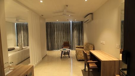 Suite at Hotel Mumbai House Express, Udaipur with a bedroom and a separate living room
