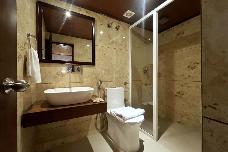 Modern bathroom with sleek fittings and spacious layout at Mount Thistle Boutique Hotel, Darjeeling.