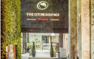 Entrance with a name board above.