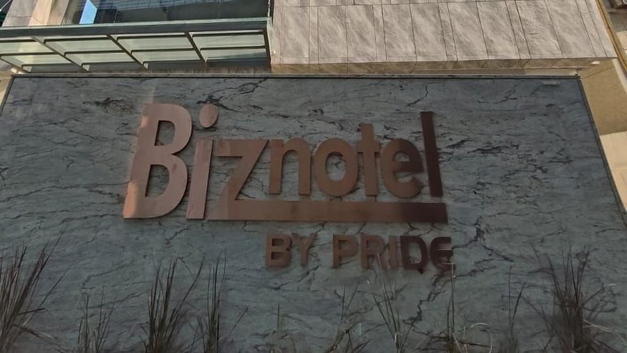 image featuring the name of the hotel on the wall of Biznotel by Pride, Motera